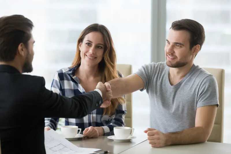 Shaking hands with a mortgage broker